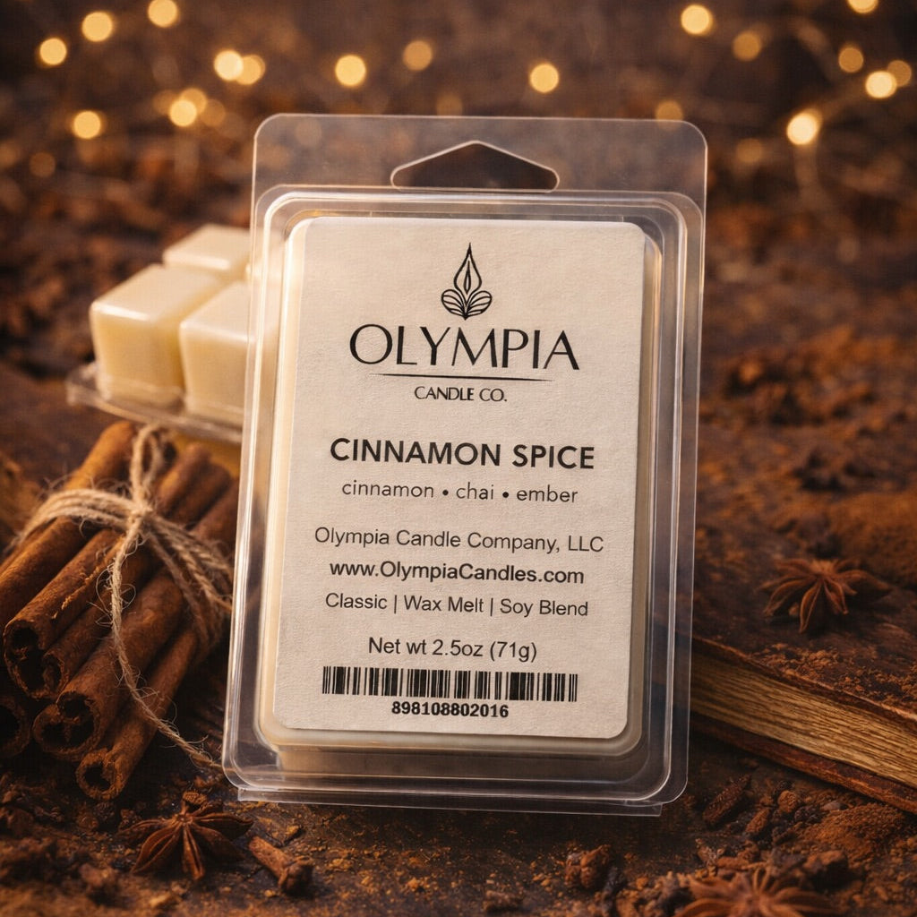 Olympia Candle Co. Cinnamon Spice wax melt package with cinnamon sticks and star anise on a dark background.