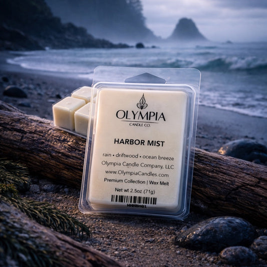 Olympia Candle Co. Harbor Mist wax melts on a beach with ocean view