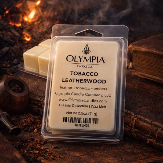 Olympia Candle Co. Tobacco Leatherwood wax melt packaging with a fire and leather background