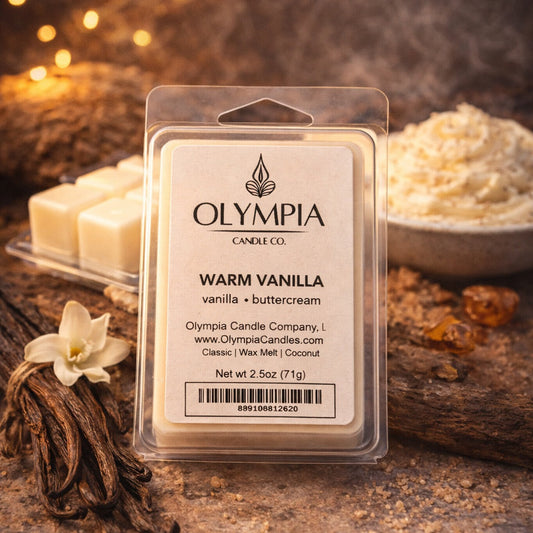 Olympia Candle Co. wax melt package with vanilla beans and flowers on a rustic background