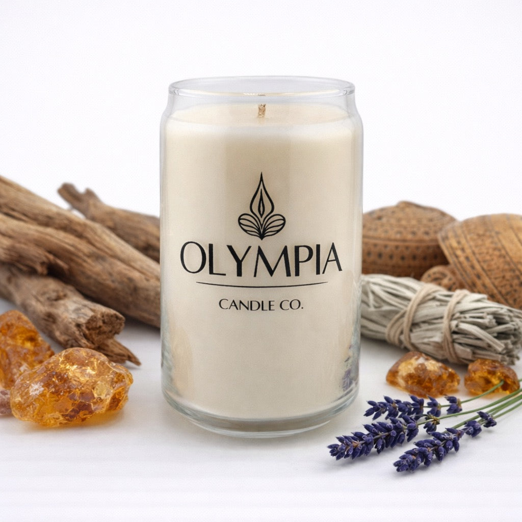 Candle from Olympia Candle Co. with natural elements like lavender and amber on a white background